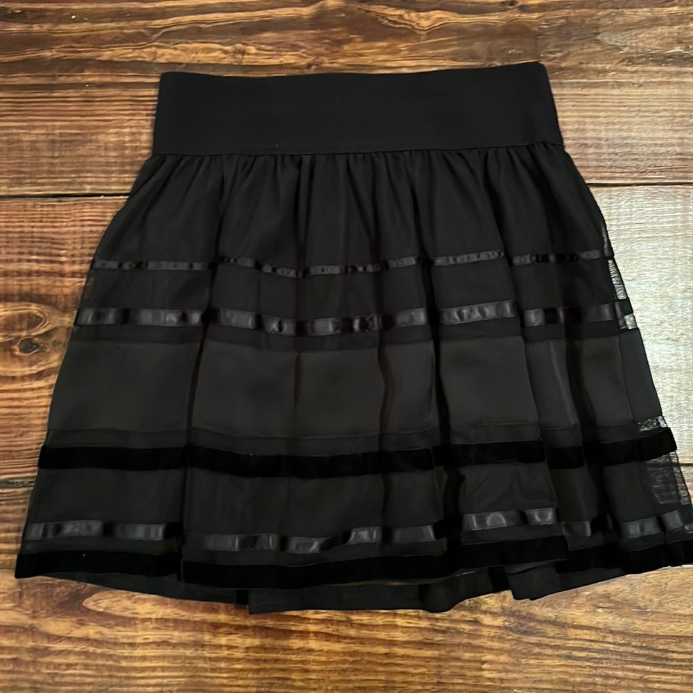NWOT. Small black mini skirt.